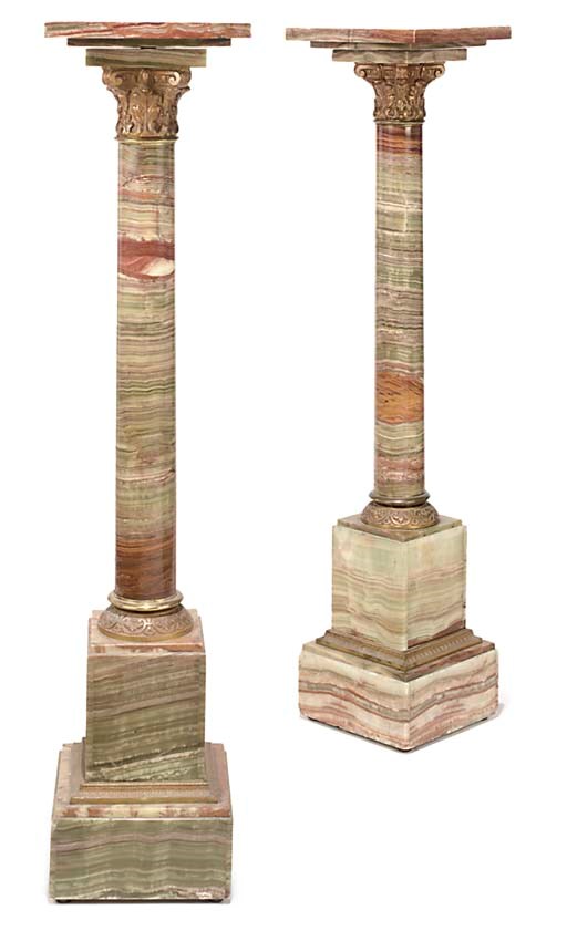A PAIR OF GILT-METAL MOUNTED ONYX PEDESTAL COLUMNS