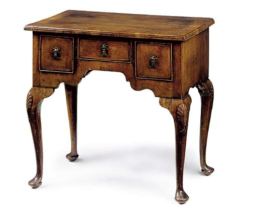 A WALNUT CROSS AND FEATHER BANDED LOWBOY