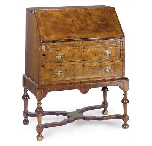 A BURR WALNUT BUREAU ON STAND
