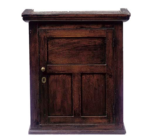 AN OAK CUPBOARD