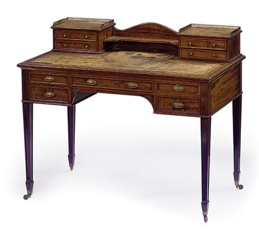 AN EDWARDIAN MAHOGANY WRITING TABLE