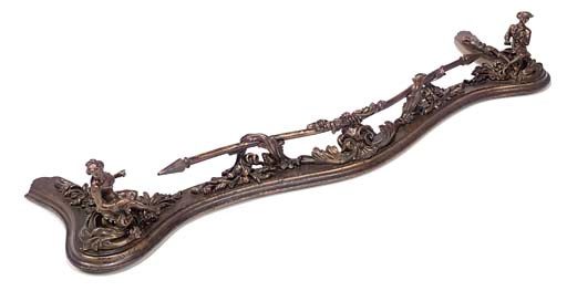 A FRENCH GILT-LACQUERED CAST-IRON FENDER