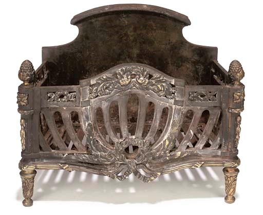 AN EDWARDIAN BRASS MOUNTED CAST-IRON FIREGRATE