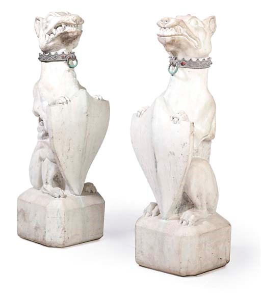 A PAIR OF COMPOSITION STONE HERALDIC DOGS