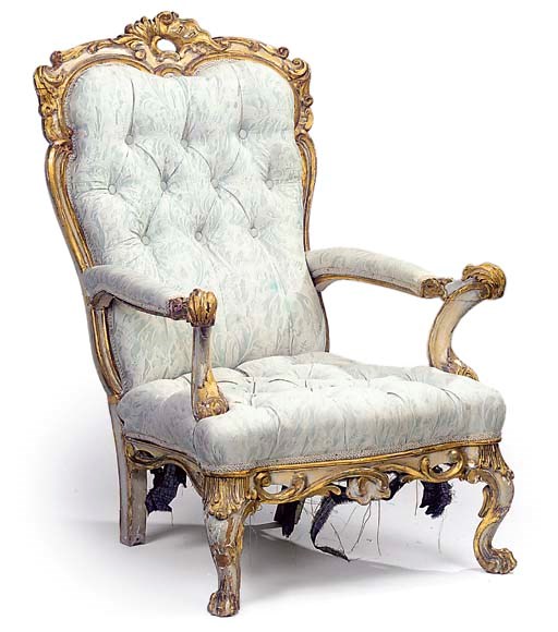 AN ITALIAN CREAM PAINTED AND PARCEL GILT ARMCHAIR