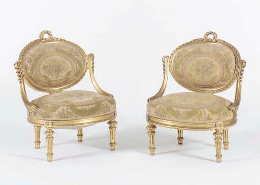 A PAIR OF LOUIS XVI STYLE GILTWOOD LOW BERGERES,