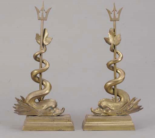 A PAIR OF DOLPHIN FORM BRASS CHENETS,