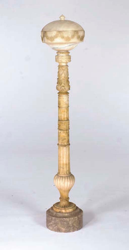 A CARVED ALABASTER FLOOR LAMP,