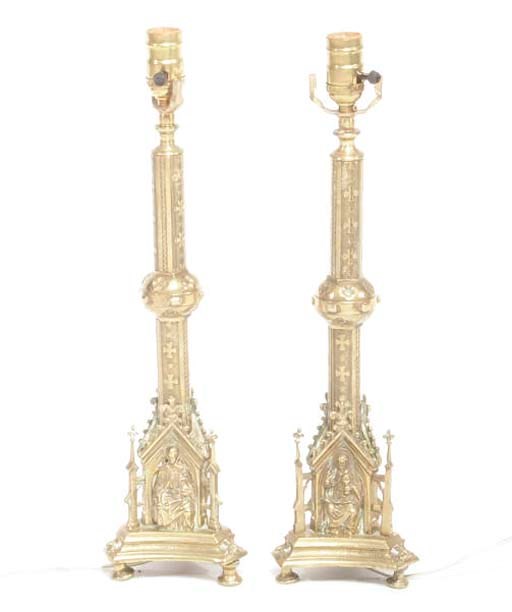 A PAIR OF GOTHIC REVIVAL GILT BRONZE CANDLESTICKS MOUNTED AS LAMPS,