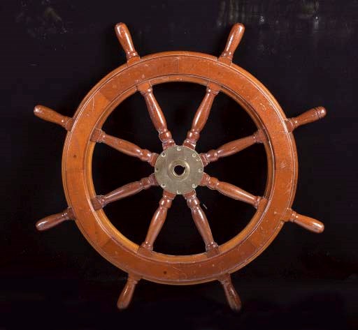 A BRASS-MOUNTED MAHOGANY SHIPS WHEEL,