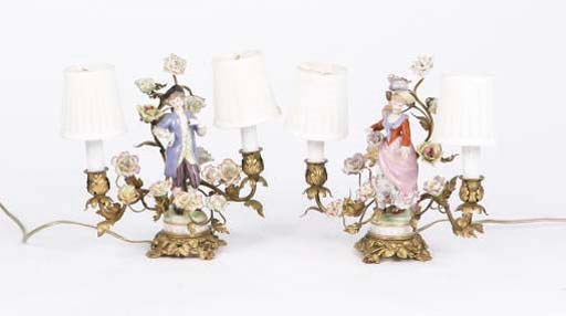A PAIR OF LOUIS XV STYLE GILT-BRONZE MOUNTED PORCELAIN FIGURAL TWO BRANCH CANDELABRA,