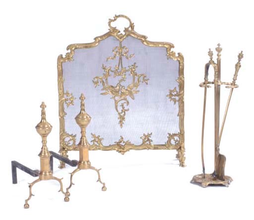 A PAIR OF BRASS ANDIRONS, A FIRESCREEN, TWO FIRE TOOLS AND A MATCHING STAND,