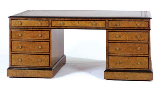 A BURR-ELM AND EBONSISED PEDESTAL DESK