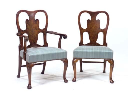 A SET OF TWELVE GEORGE II STYLE WALNUT DINING CHAIRS,