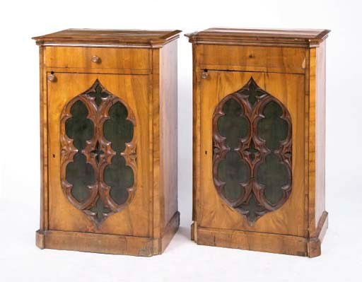 A PAIR OF GOTHIC REVIVAL WALNUT AND PARCEL EBONISED SIDE CABINETS,