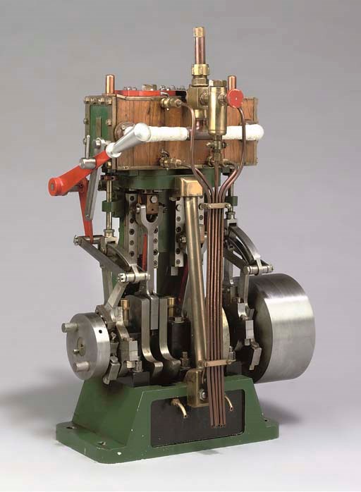 A well engineered small full size twin cylinder vertical reversing marine engine,