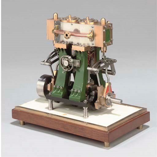 A well engineered and presented model twin cylinder vertical reversing marine engine,