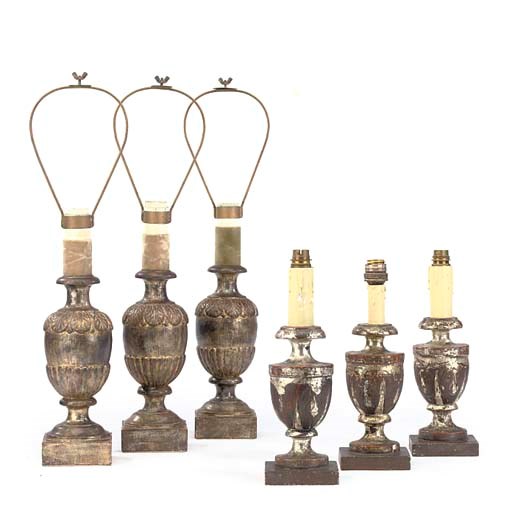 A SET OF THREE SILVERED WOOD TABLE LAMPS