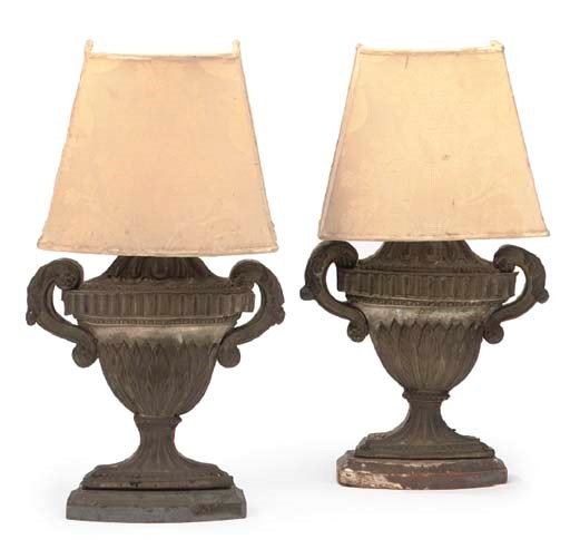A PAIR OF CONTINENTAL SILVERED REPOUSSE METAL AND PAINTED WOOD ALTAR LAMPS