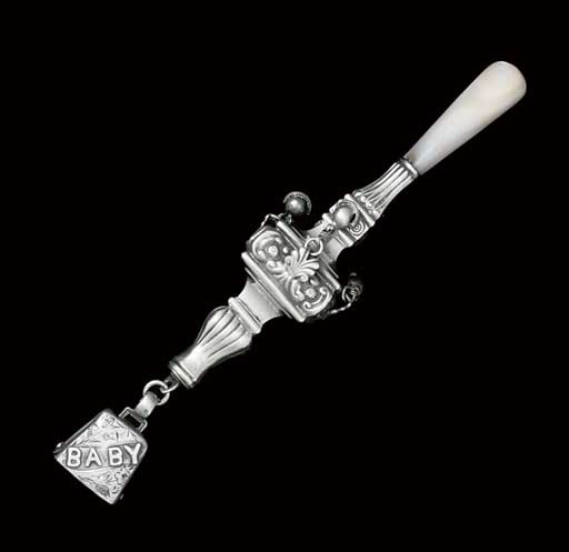 A GEORGE V SILVER AND MOTHER-OF-PEARL RATTLE