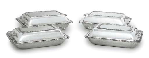 A SET OF FOUR GRADUATED SPANISH SILVER ENTRÉE-DISHES AND COVERS