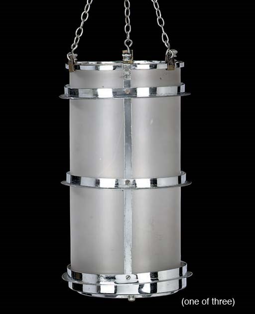 A set of three chrome metal frosted glass lanterns