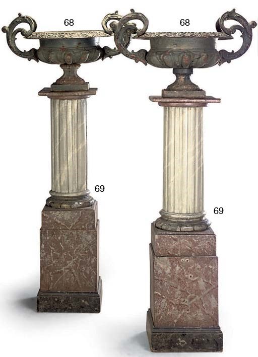 A PAIR OF PAINTED WOOD PEDESTAL COLUMNS