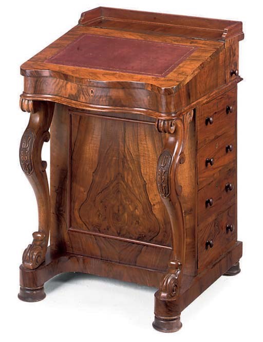 A MID VICTORIAN WALNUT DAVENPORT