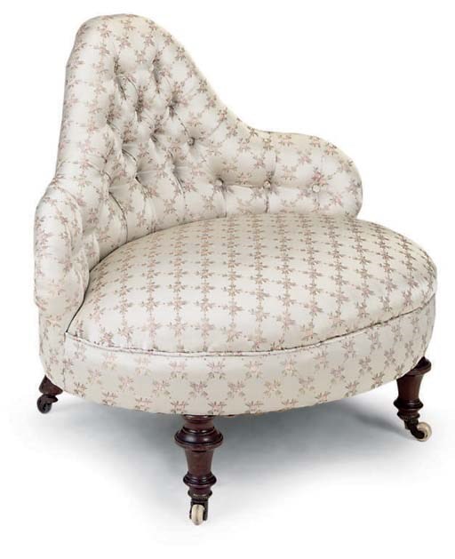 A MID VICTORIAN MAHOGANY NURSING CHAIR