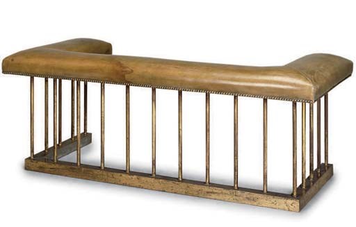A LEATHER UPHOLSTERED BRASS CLUB FENDER