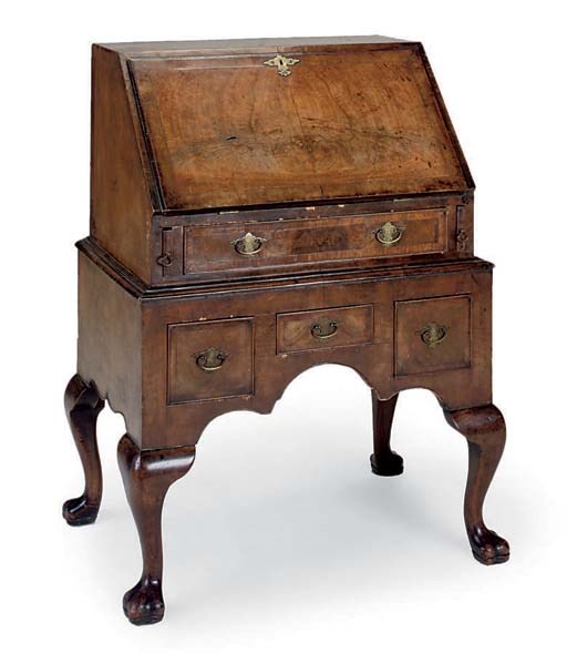A WALNUT BUREAU ON STAND