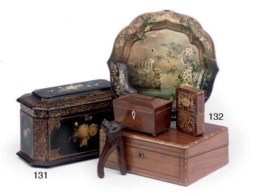 A VICTORIAN GILT-HEIGHTENED AND PAINTED PAPIER-MÂCHÉ TEA CADDY