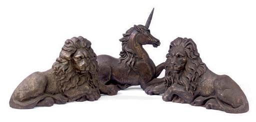 A PAIR OF CAST IRON MODELS OF LION DOORSTOPS