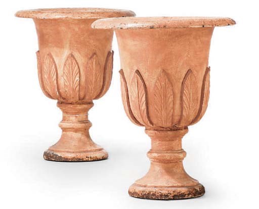 A PAIR OF CAST IRON GARDEN URNS