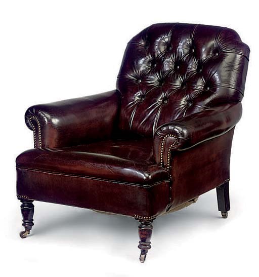 A LEATHER UPHOLSTERED BEECH ARMCHAIR