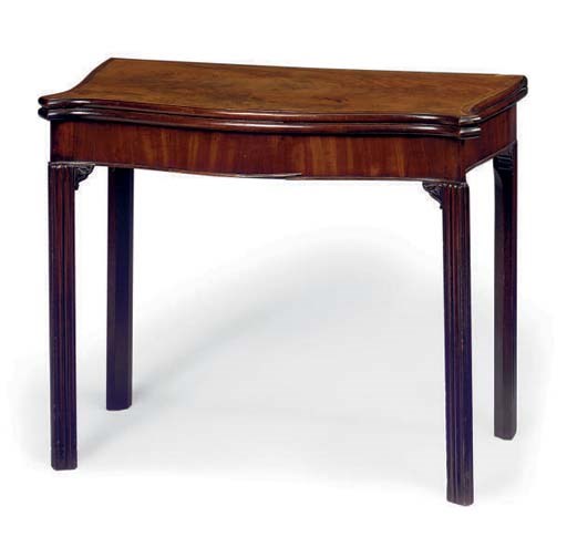 A GEORGE III MAHOGANY SERPENTINE GAMES TABLE