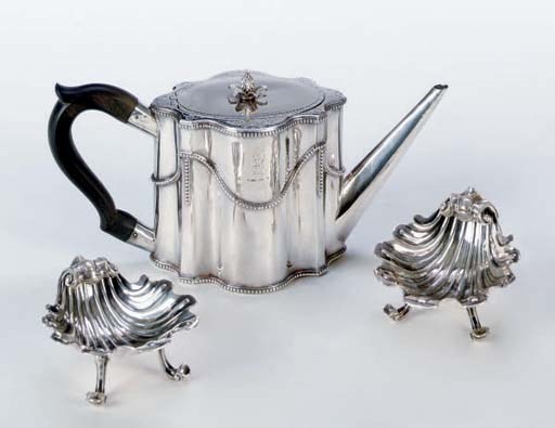 A GEORGE III SILVER TEAPOT AND DISH CROSS AND A PAIR OF ANGLO-IRISH SHELL-FORM SALTS,