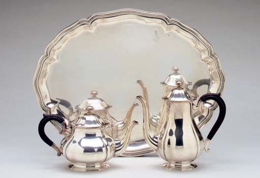 A SWISS SILVER FIVE-PIECE TEA AND COFFEE SERVICE AND MATCHING SHAPED OVAL TRAY**,