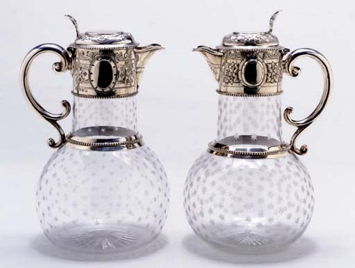 A PAIR OF VICTORIAN SILVER-MOUNTED ETCHED GLASS CLARET JUGS,