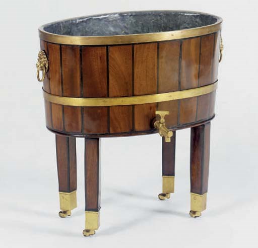 AN ENGLISH BRASS-BOUND MAHOGANY AND EBONIZED OVAL WINE COOLER,