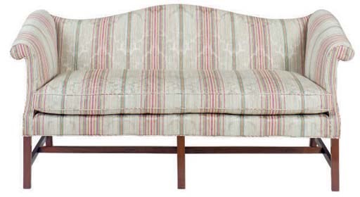 AN ENGLISH MAHOGANY SCOOP CAMEL BACK-SOFA,