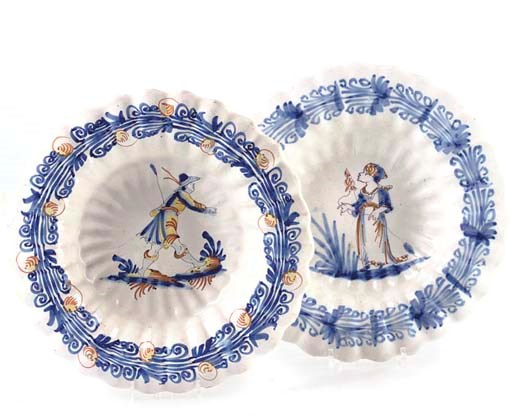 TWO FAIENCE FLUTED DISHES