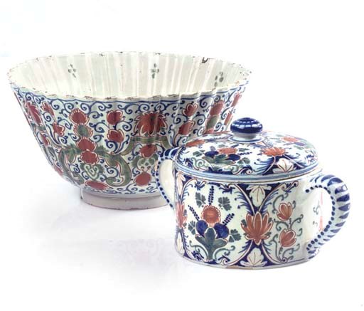 A DUTCH DELFT POLYCHROME REEDED DEEP BOWL AND TWO-HANDLED CYLINDRICAL JAR AND COVER