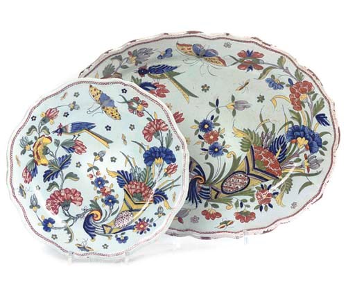 A ROUEN FAIENCE SHAPED OVAL DISH AND A SIMILAR PLATE