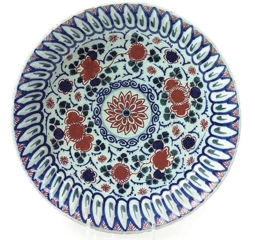 A DUTCH DELFT POLYCHROME GADROONED DEEP DISH