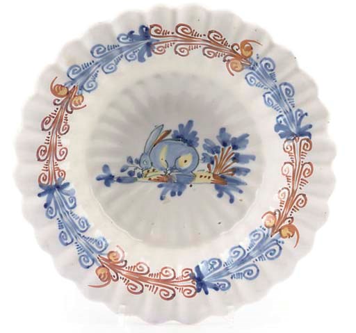 A FAIENCE FLUTED DISH