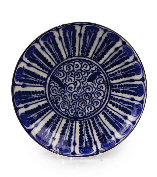 A FAIENCE BLUE AND WHITE SAUCER DISH