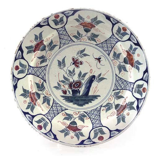 AN ENGLISH DELFT POLYCHROME LARGE DISH