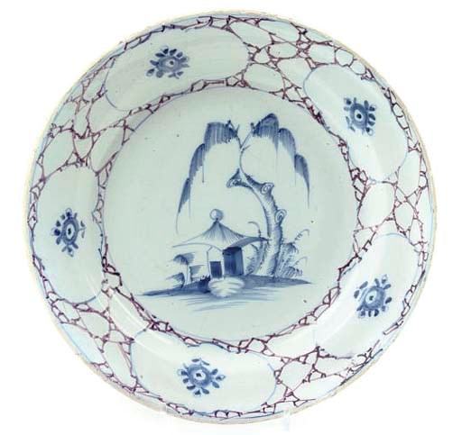 A BRISTOL DELFT BLUE AND MANGANESE DISH