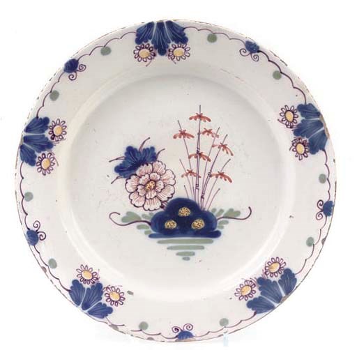 AN ENGLISH DELFT POLYCHROME DISH